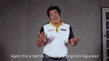 a man in a black and white shirt with the words again this is derrick tan magtaanong para sigurado