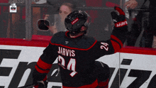 a hockey player wearing a jersey with the name jarvis on it