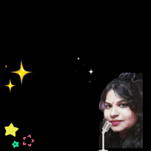 a woman singing into a microphone in front of a sign that says good luck simi