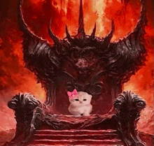 a cat with a pink bow is sitting on a throne in front of a demon