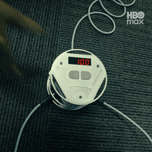 a hbo max advertisement with a clock on the floor