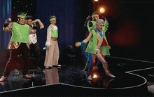 a group of people are dancing on a stage with a watermark that says vonxoodstudio