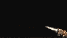 a man in a military uniform is holding a gun with smoke coming out of it