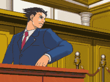 a man in a suit and tie is standing at a podium in a courtroom