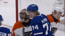 a hockey player with the number 74 on their jersey
