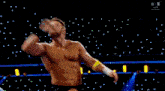 a wrestler in a wrestling ring with a banner that says smackdown