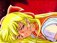 a girl with blonde hair and a red bow on her head is laying down