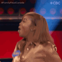 a woman in a gold shirt with a name tag that says ' allen '