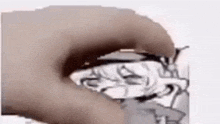a close up of a person holding a drawing of a person .