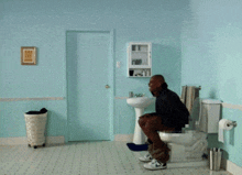Dave Chappelle Sitting On The Toilet Meme GIF