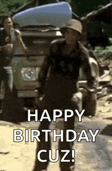 a man in a cowboy hat is dancing in front of a truck and says happy birthday cuz !