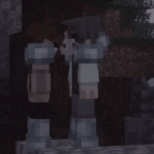 a couple of minecraft characters are standing next to each other in a dark room .