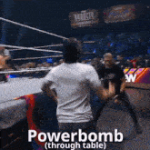 a man is standing in a wrestling ring with the words powerbomb through table written on the bottom