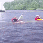 a person in a life jacket is floating in the water