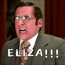 a man in a suit and tie is yelling at eliza