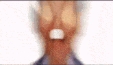 a close up of a man 's face with his mouth open and a white nose