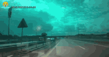 a picture of a highway with a crying face on the bottom right corner