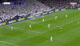two soccer players are celebrating a goal during a soccer game .