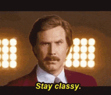 a man in a suit and tie says stay classy .