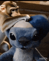 a stuffed animal with the word inshot at the bottom of it