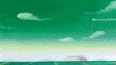 a green sky with a few clouds in it