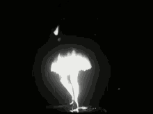 a black and white photo of a woman 's bare feet walking on a wet floor .