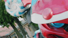a close up of a robot 's head with blue eyes