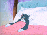 a cartoon cat is laying in a bed with a pink blanket