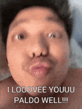 a man is making a funny face with his mouth open and says `` i looovee youuu paldo well ! ''
