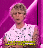 a man with a pearl necklace is talking about loving someone