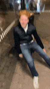 a blurry picture of a man sitting on a bench .