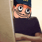 a person is typing on a laptop with a picture of a cartoon character behind them