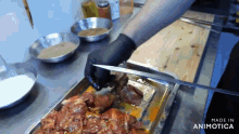a person is cutting a piece of meat with a knife and the words made in animotica are on the bottom of the screen