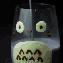 a glass with a pumpkin face drawn on it and the words mrcakes on the bottom