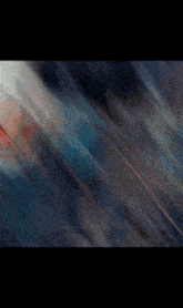 a blurred image of a person 's face with a red white and blue background