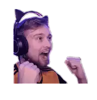 a man wearing a cat ear headset holds his fist up