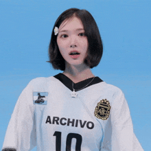 a girl wearing a archivo jersey with the number 10