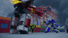 a group of robots are standing in front of a warehouse