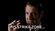 a man in a suit and tie is saying his strike zone ..