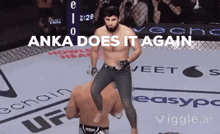 a man in a boxing ring with the words anka does it again above him