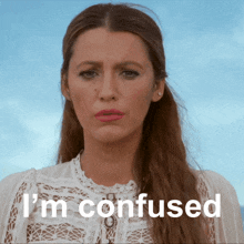 a woman in a white lace top is confused