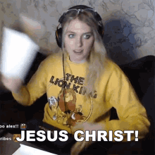 a woman wearing a yellow lion king sweatshirt says " jesus christ "