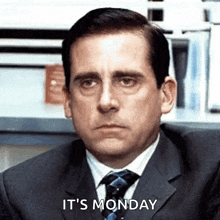 a man in a suit and tie is sitting in an office and says it 's monday .
