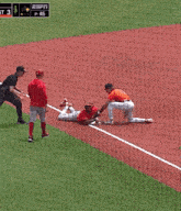 a group of baseball players wearing red jerseys with espn written on the bottom