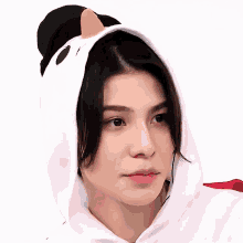 a close up of a person wearing a chicken costume