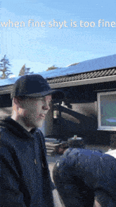 a man wearing a black hat is standing in front of a house with the words when fine shyt is too fine