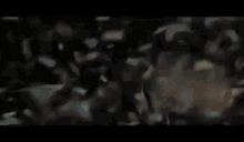 a blurry picture of a crowd at a party