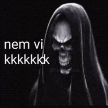 a grim reaper with a hood and a skull on his head .