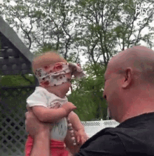 Lifting The Baby Happily GIF