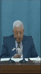 a man in a suit and tie with an ostrich face on his face